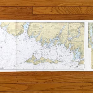 May include: A nautical chart of Long Island Sound waters, from Niantic Bay to Watch Hill, with detailed depictions of the coastline, depths, and navigational features. The chart is printed on white paper and includes the number 11 in the upper corners.