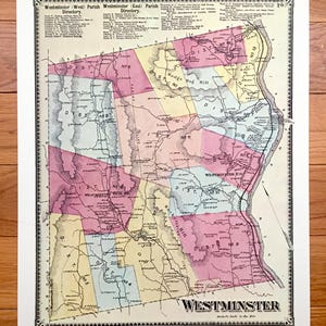 May include: Antique map of Westminster, featuring a detailed layout with district divisions and names. The map is colored in pastel shades of pink, yellow, and blue, with black text and lines. The title "Westminster" is prominently displayed at the bottom.