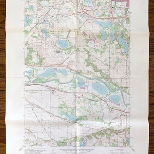 May include: A vintage topographic map of the Eden Prairie, Minnesota area. The map shows roads, rivers, lakes, and other geographical features. The map is titled "Eden Prairie Quadrangle" and includes the text "15 MINUTE SERIES (TOPOGRAPHIC)".