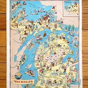 以下が含まれることがあります： ミシガン州のヴィンテージイラストマップ。漫画のキャラクターとランドマークが描かれています。マップは白地に青色の枠で、赤いバナーに「ミシガン」と「At Its Best」の文字が書かれています。