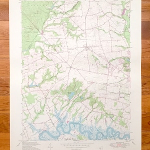 May include: A vintage topographic map of the  "Tolson" quadrangle in New Jersey. The map shows the area around the town of  "Lower Alloways Creek" and the "Greenwich" river. The map is printed on a white background with green, blue, and brown lines and text.