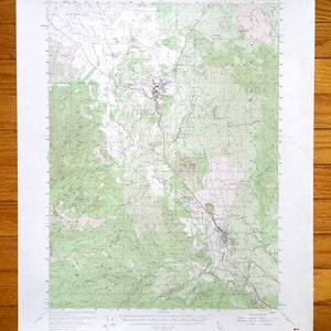 May include: A vintage topographic map of the Weed, California area. The map shows roads, rivers, and elevation contours. The map is printed on paper and has a green and brown color scheme. The map is titled "Weed, California" and is part of the "United States Geological Survey" series.