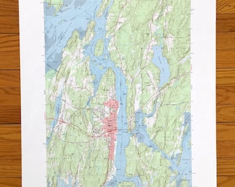May include: A vintage topographic map of Bath, Maine, printed by the United States Geological Survey. The map shows the city's streets, waterways, and surrounding terrain. The map is in black, white, blue, and green.