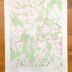 May include: A vintage map of the area around Manassas National Battlefield Park in Virginia. The map is printed on white paper with green and brown lines indicating roads, rivers, and other geographical features. The map is titled "UNITED STATES DEPARTMENT OF THE INTERIOR GEOLOGICAL SURVEY" and "MANASSAS NATIONAL BATTLEFIELD PARK".