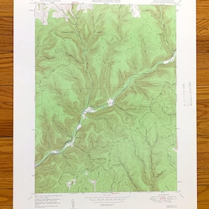 May include: A vintage topographic map of the Allegheny National Forest in Pennsylvania. The map shows the terrain with contour lines and includes the names of various locations, such as "Allegheny River" and "Tionesta Creek".