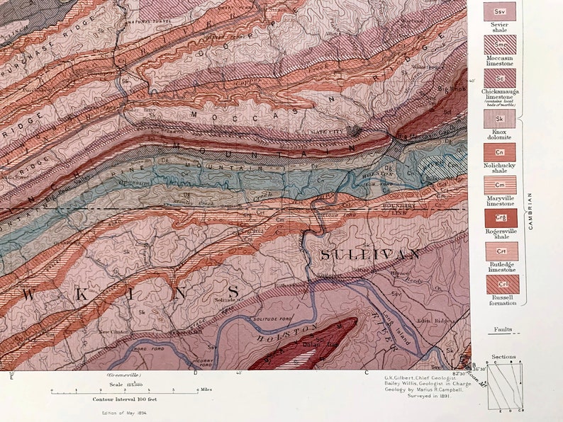 Puede incluir: Un mapa geol&oacute;gico del &aacute;rea de Moccasin Mountain en Tennessee, que muestra las diferentes formaciones rocosas y sus edades. El mapa est&aacute; codificado por colores, con diferentes colores que representan diferentes tipos de rocas. El mapa tambi&eacute;n muestra la ubicaci&oacute;n de fallas y otras caracter&iacute;sticas geol&oacute;gicas.