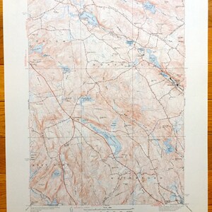 May include: A vintage topographic map of the Montiville, Connecticut area. The map shows roads, rivers, lakes, and elevation contours. The map is printed on a white background with brown and blue lines.
