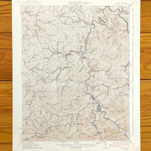 May include: A vintage topographic map of the area around the town of Thomasville, North Carolina. The map shows roads, rivers, and elevation contours. The map is printed on paper and has a brown and white colour scheme.