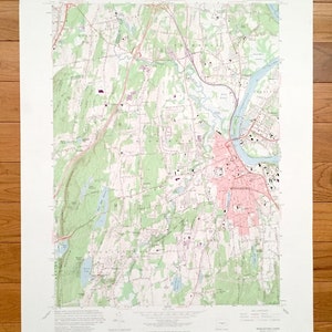 May include: A vintage topographic map of Middletown, Connecticut, showing roads, rivers, and other geographical features. The map is printed on paper and has a light green, brown, and blue color scheme. The map is titled "Middletown Quadrangle" and includes the text "7.5 Minute Series (Topographic)".
