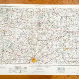 May include: A vintage map of Fort Wayne, Indiana, showing roads, rivers, and towns. The map is printed on white paper with black, red, and blue lines. The map is titled "Fort Wayne" in the upper center.