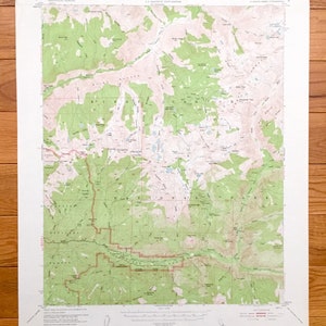 May include: A vintage topographic map of the  "Marion Peak, Calif." area, showing the Kings Canyon National Park. The map is printed on white paper with green, brown, and blue lines and text. The map includes elevation lines, rivers, lakes, and trails.
