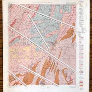 May include: A vintage geological map titled "Structure-Section Sheet" of the Georgia-Alabama Rome Quadrangle. The map features a detailed illustration with various colors and patterns, including brown, pink, and blue hues. The map has white lines across it.