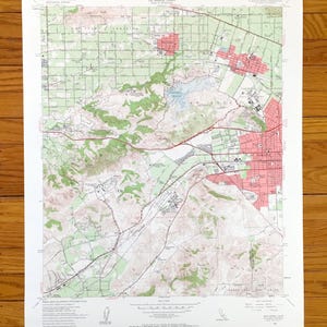 May include: A vintage topographic map of Santa Ana Canyon, California, showing the area's terrain, roads, and landmarks. The map is printed in black, red, and green on white paper. The map includes the text "Santa Ana Canyon, California" and "7.5 Minute Series (Topographic)".