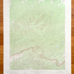 May include: A vintage map of George Washington National Forest in Virginia. The map shows the forest's boundaries, roads, trails, and elevation contours. The map is printed on a light green background with brown lines and text.