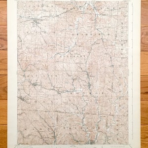 May include: A vintage topographic map of the Pleasant, MD area. The map shows the location of roads, rivers, and other geographical features. The map is printed on paper and has a brown and white color scheme.