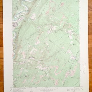 May include: A vintage topographic map of the Carbon, Pennsylvania area. The map shows the location of roads, rivers, and other geographical features. The map is printed on a light green background with brown lines and text.