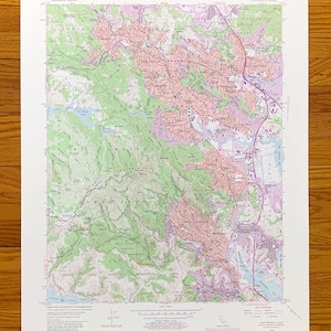 May include: A vintage topographic map of San Rafael, California, showing the city's streets, parks, and surrounding hills. The map is printed in black, green, brown, and pink on a white background. The map is titled "San Rafael Quadrangle" and includes the text "United States Department of the Interior Geological Survey".