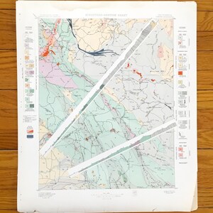 May include: A vintage geological map titled "Structure-Section Sheet" of California. The map features a detailed illustration with various colors representing different geological formations. The map has diagonal cuts across it.
