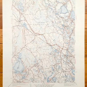 May include: A vintage topographic map of Middleborough, Massachusetts, showing the area's terrain, roads, and waterways. The map is printed in black, red, and blue ink on white paper. The map is titled "Middleborough, Massachusetts" and includes the text "South Purchase" and "Rochester".