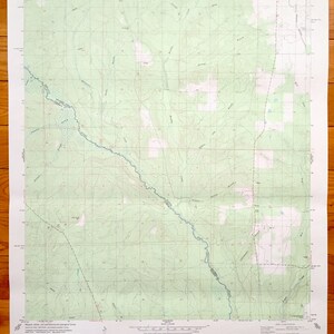 May include: A vintage topographic map of the Ekon Quadrangle in Florida. The map is printed on paper and shows the terrain, rivers, and roads in the area. The map is dated 1958 and is part of the United States Geological Survey.