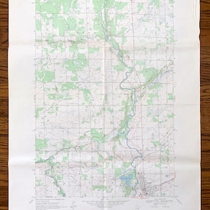 May include: A vintage topographic map of the Milaca Quadrangle in Minnesota, showing the area around Milaca Lake. The map is printed on white paper with green, brown, and blue lines and text. The map is titled "Milaca Quadrangle" and includes the text "UNITED STATES DEPARTMENT OF THE INTERIOR GEOLOGICAL SURVEY" and "STATE OF MINNESOTA DEPARTMENT OF ADMINISTRATION".