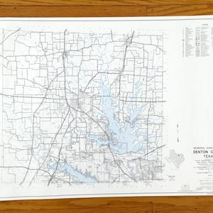 May include: A General Highway Map of Denton County, Texas, showing a detailed road network in black lines. The map includes blue water features and a legend. The title and county name are clearly visible.