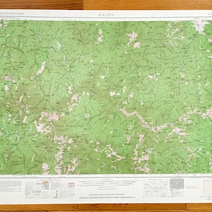 May include: A vintage map of Elk City, Oklahoma, showing the surrounding area with green and brown topographical features. The map is titled "Elk City" and includes the text "WESTERN UNITED STATES SERIES (1:250,000)" in the top left corner and "U.S. GEOLOGICAL SURVEY" in the bottom right corner.