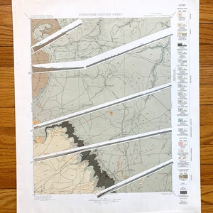 May include: A geological map of the Walsenburg Quadrangle in Colorado. The map shows the different rock formations and their ages. The map is divided into sections, each with a different color. The map also includes a legend that explains the different colors and symbols.