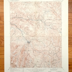 Può includere: Una mappa topografica vintage della zona di Mt. Jackson, Colorado. La mappa è stampata su carta color crema e mostra il terreno con linee di contorno marroni. La mappa include il testo "UNITED STATES DEPARTMENT OF THE INTERIOR GEOLOGICAL SURVEY" e "MT. JACKSON, COLO."