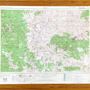 May include: A vintage map of Bend, Oregon, with green areas indicating forested regions. The map is printed on white paper and includes a title, scale, and legend. The map is dated 1953.