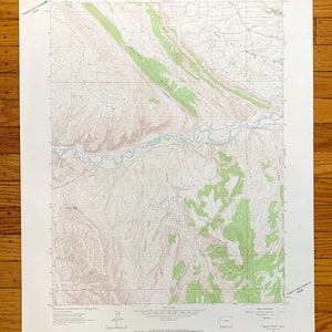 May include: A vintage topographic map of the Banty Point Quadrangle, featuring detailed contour lines, rivers, and vegetation areas in shades of green and brown. The map includes text indicating the U.S. Department of the Interior and the Geological Survey.