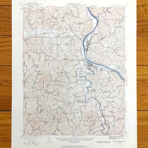 Puede incluir: Un mapa topográfico vintage de Saint Albans, Virginia Occidental, publicado por el Departamento del Interior de los Estados Unidos, Servicio Geológico. El mapa muestra el área alrededor de Saint Albans, incluido el río Ohio, con líneas de contorno y otras características geográficas.