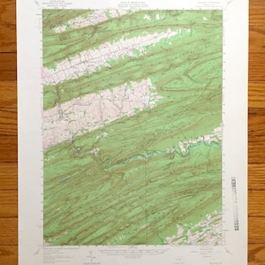May include: A vintage topographic map of the Haines, Pennsylvania area. The map shows the terrain with green and brown contour lines. The map is titled "Haines, Pennsylvania" and includes the text "GEOLOGICAL SURVEY" in the bottom right corner.
