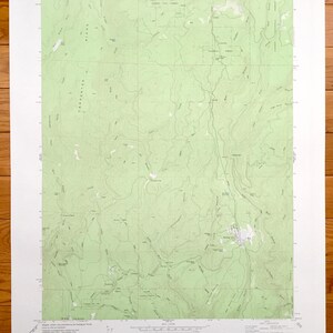 May include: A topographic map of the Sterling City Quadrangle, Columbia Butte, Oregon. The map shows the area's terrain, including mountains, rivers, and roads. The map is printed on a white background with green lines and text.