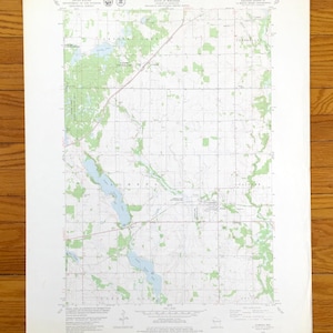 May include: A black and white topographic map of Cumberland, Wisconsin. The map shows the location of roads, rivers, lakes, and other geographical features. The map is titled "Cumberland, Wis."