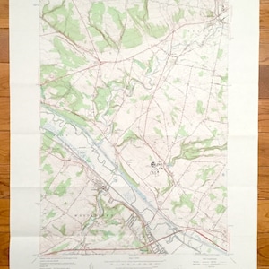 May include: A vintage topographic map of the state of New York, showing the area around the town of Marcy, New York. The map is printed on a white background with green, brown, and blue lines and text. The map is titled "State of New York" and "Marcy Quadrangle".