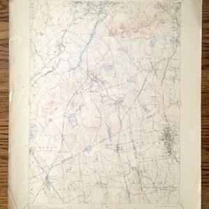 May include: A vintage map of the area around the towns of Northborough, Westborough, and Shrewsbury, Massachusetts. The map is printed on cream-coloured paper and shows the roads, rivers, and lakes in the area. The map is dated 1918.