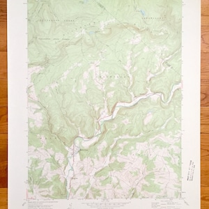 May include: A vintage topographic map of Picture Rocks, Pennsylvania, showing the area around the Picture Rocks Creek. The map is printed on paper and has a green and brown color scheme. The map includes details such as elevation contours, roads, and water features.