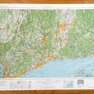 May include: A vintage map of Hartford, Connecticut, showing the city and surrounding areas. The map is printed on white paper and features a green and blue color scheme. The map is titled "HARTFORD" in the upper center. The map is dated "No. 36-12".