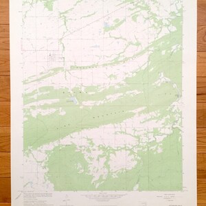 May include: A vintage topographic map of the Pittsburg, Oklahoma area. The map shows the location of roads, rivers, and other geographical features. The map is printed on a white background with green lines and text.