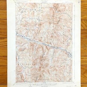 May include: A vintage topographic map with brown and white shading, depicting a detailed landscape with contour lines, roads, and water features. The map includes place names such as Richmond, Bolton, and Huntington. The map is on aged paper.