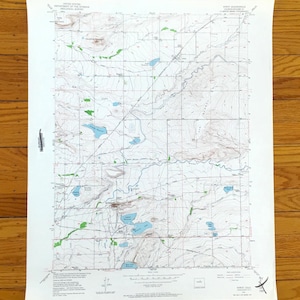 May include: A vintage topographic map with detailed contour lines, water features, and green shaded areas. The map is printed on aged paper and shows the "Mount Soda" area. The map is from the United States Department of the Interior.