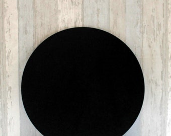 May include: A black round cake board, perfect for displaying cakes and other desserts.