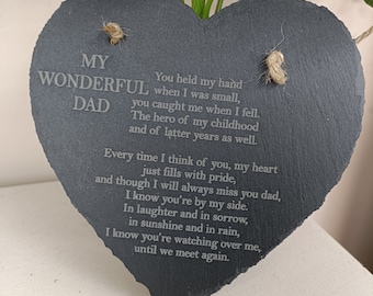 May include: A black heart-shaped slate plaque with a heartfelt message about a wonderful dad. The plaque is engraved with the words "My Wonderful Dad" and a poem about the love and memories shared with a father.