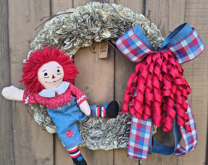 Featured listing image: 21 inch Raggedy Ann Book Page Wreath | Patriotic Farmhouse Decor, Red White Blue Wall Hanging