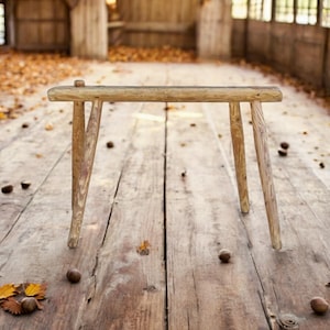 Antique wooden bench in wabi-sabi style, weathered wood, narrow stool in country house style, shabby chic