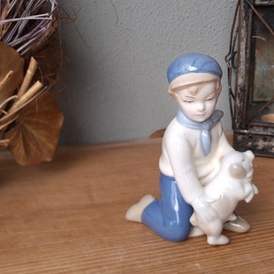 Wagner and Apel porcelain figurine boy with pig from GDR times - Thuringian porcelain figurine