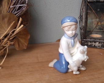 Wagner and Apel porcelain figurine boy with pig from GDR times - Thuringian porcelain figurine