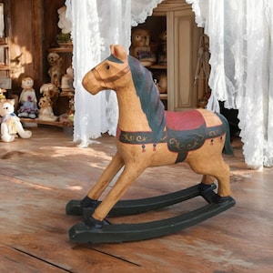 Vintage rocking horse made of papier-mâché