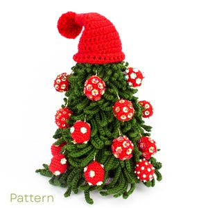 May include: A green crocheted Christmas tree with red crocheted baubles and a red crocheted Santa hat on top.